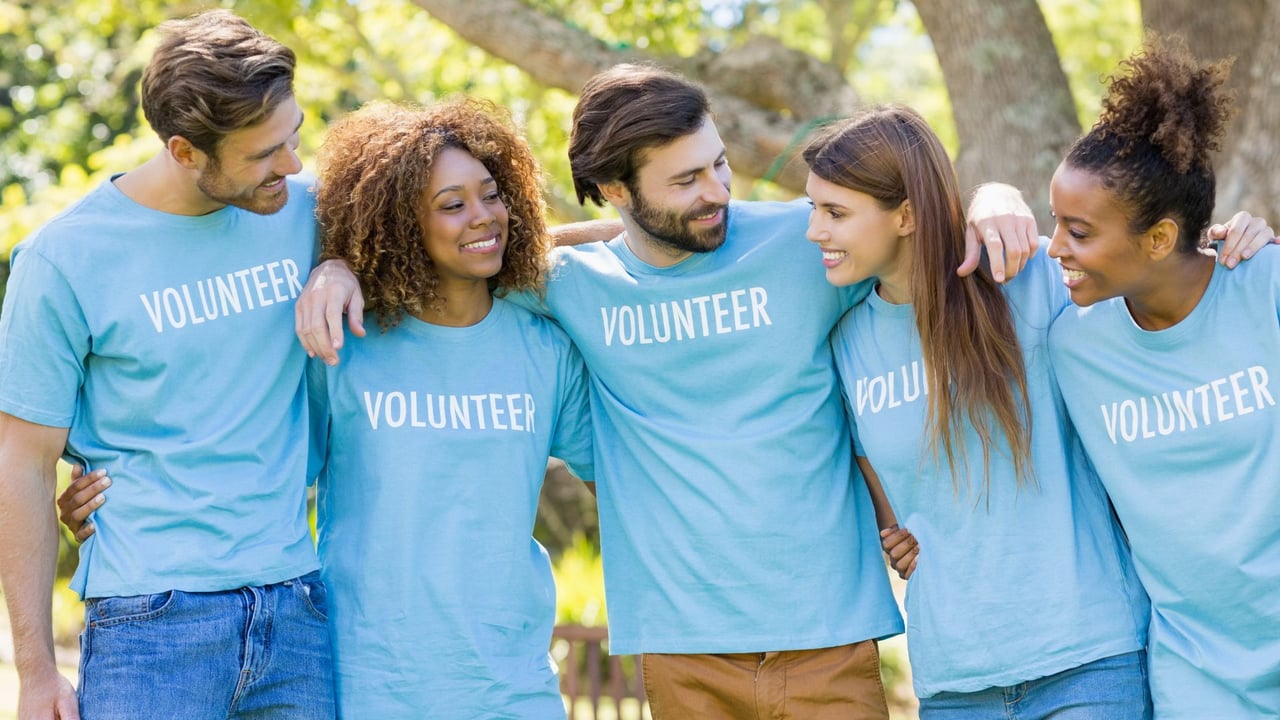 A happy group of volunteers standing together 